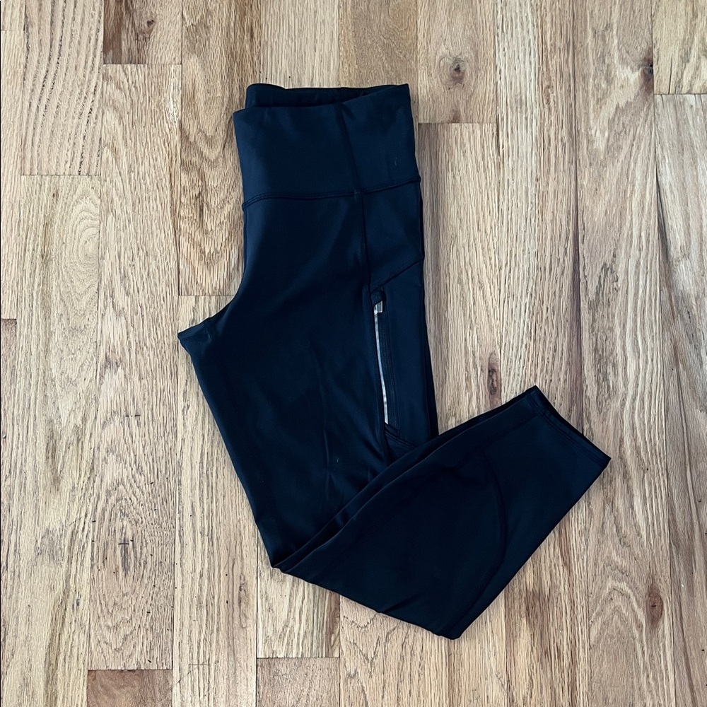 Chic Black Athleta Leggings with Zipper Accents